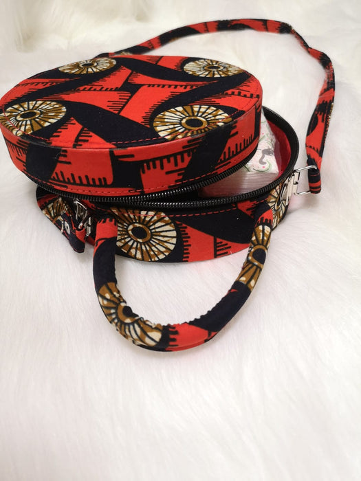 HANDMADE AFRICAN PRINT CIRCLE BAG RED, YELLOW, BLACK AND WHITE BAG