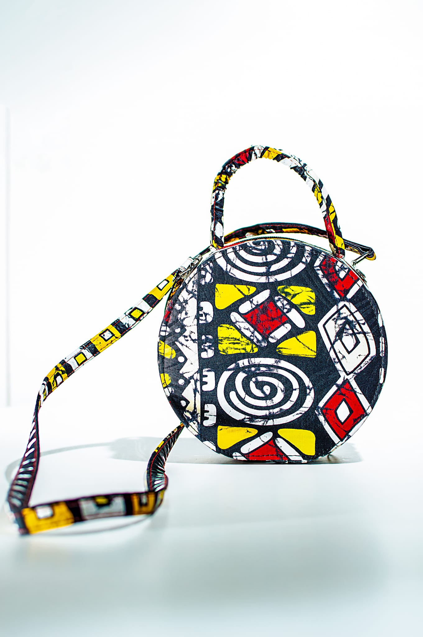 HANDMADE AFRICAN PRINT CIRCLE BAG WHITE, YELLOW, RED & BLACK BAG