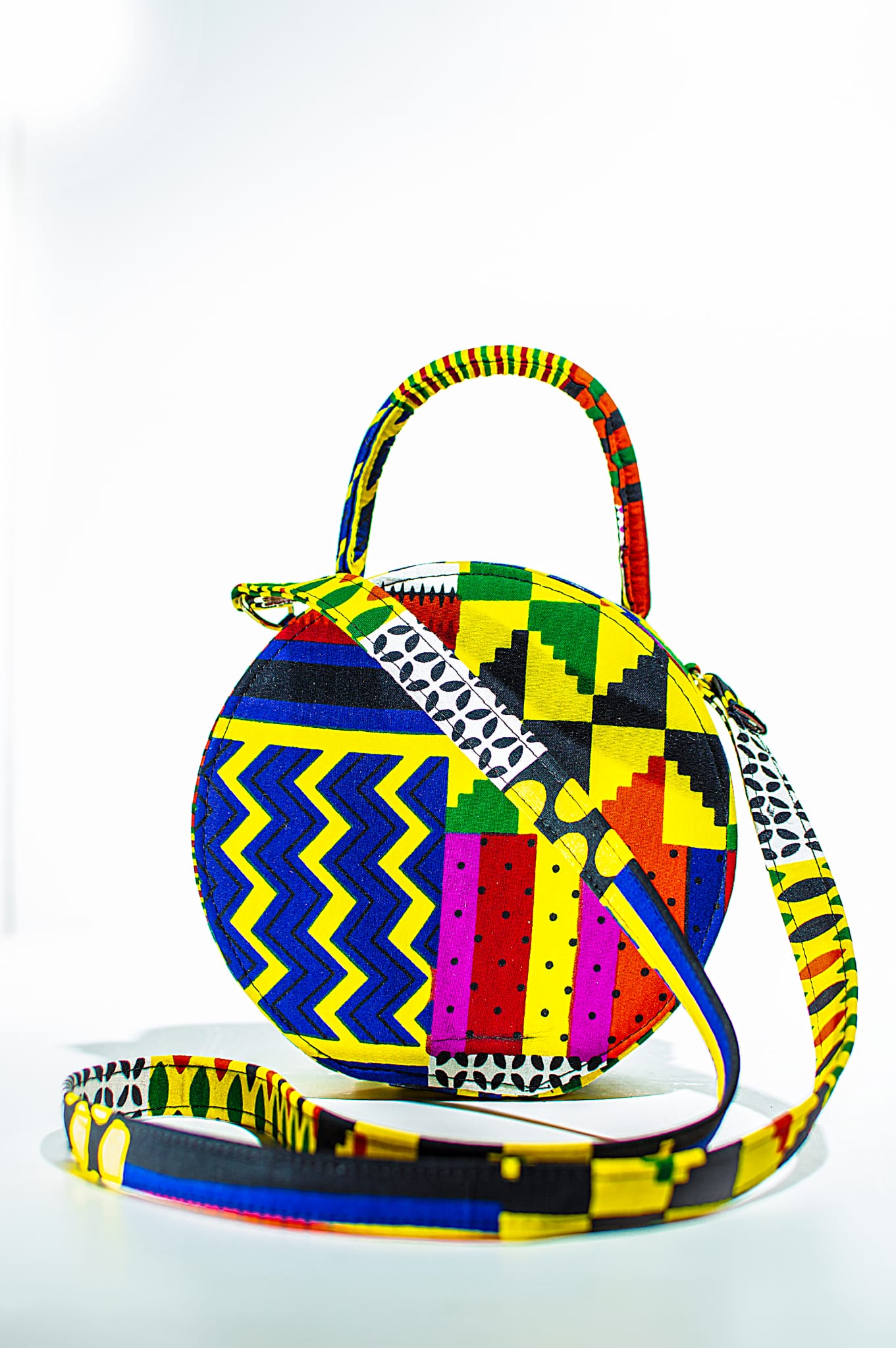 HANDMADE AFRICAN PRINT CIRCLE BAG BLUE, YELLOW, BLACK, RED, WHITE & PINK BAG